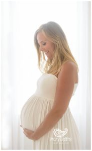 Augusta GA photographer images of all-natural light maternity session with mother dressed in white dress | Mary Beth's Photography