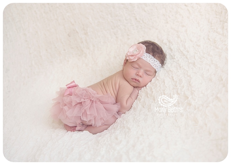 Augusta GA Newborn baby girl portrait on a white blanket with a pink tutu and bow | Mary Beth's Photography | Augusta GA Newborn Photographer, Augusta GA Family Photography
