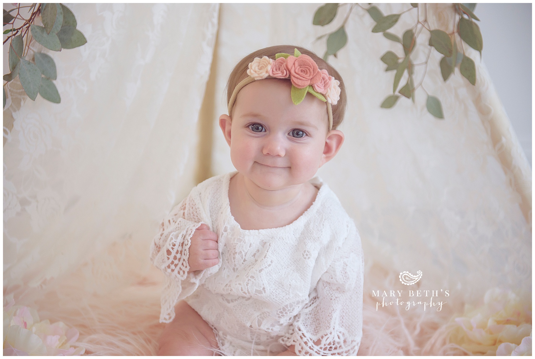  6 month portrait of girl in a lace teepee