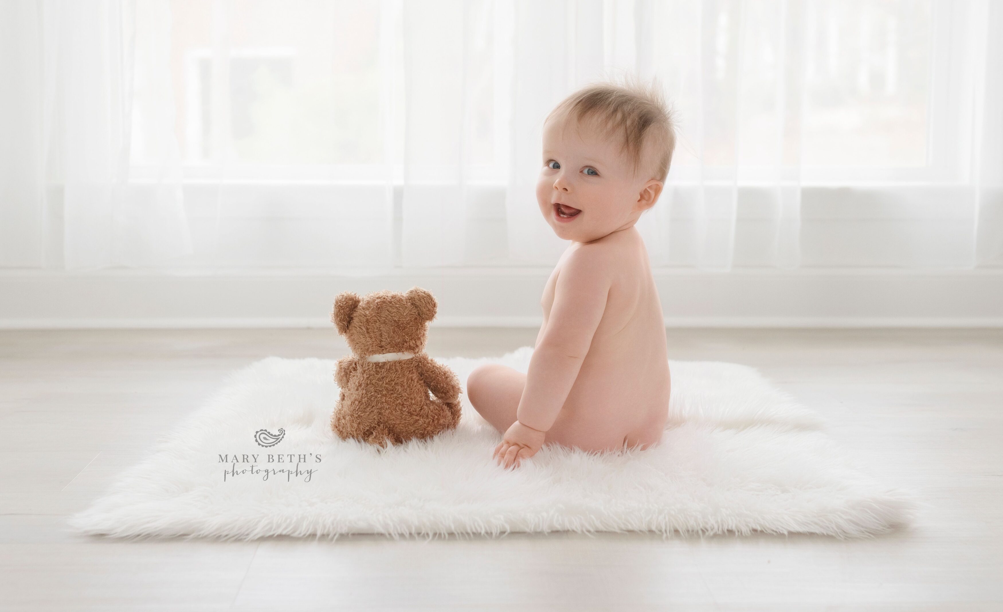 baby boy with teddy bear portrait